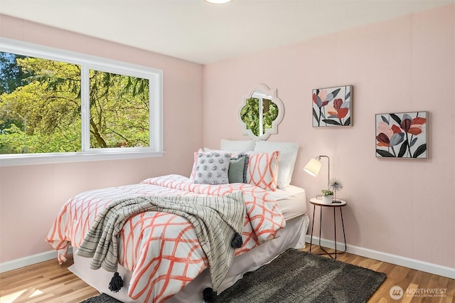 12802 NE 26th Pl, Bellevue, WA 98005 - bedroom featuring baseboards and wood finished floors