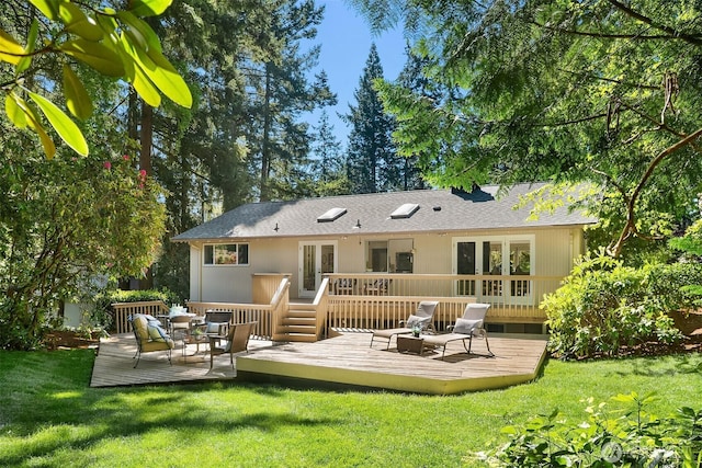 12802 NE 26th Pl, Bellevue, WA 98005 - rear view of property featuring french doors, a wooden deck, and a yard