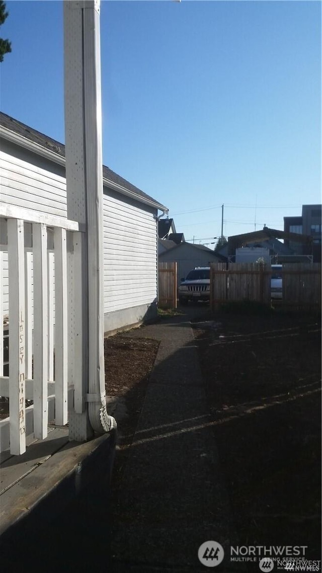 view of side of property with fence