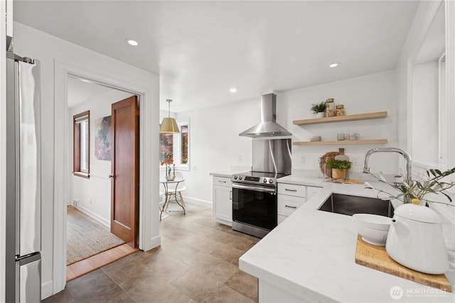 kitchen with stainless steel electric range, wall chimney range hood, a sink, open shelves, and white cabinets