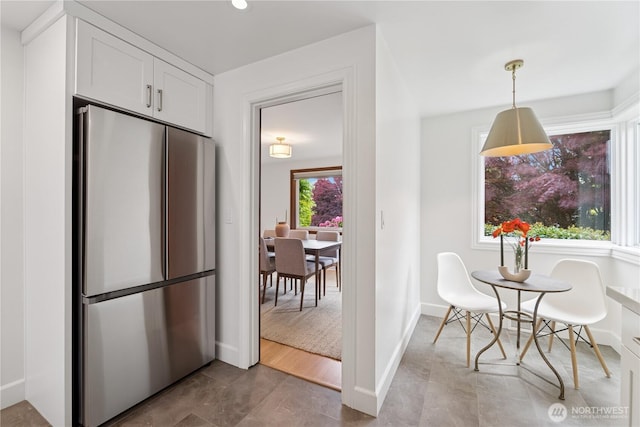 tiled dining area with baseboards