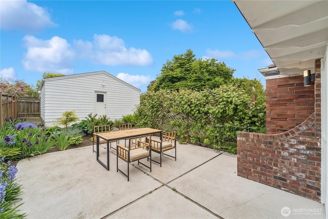 view of patio / terrace with outdoor dining space and fence