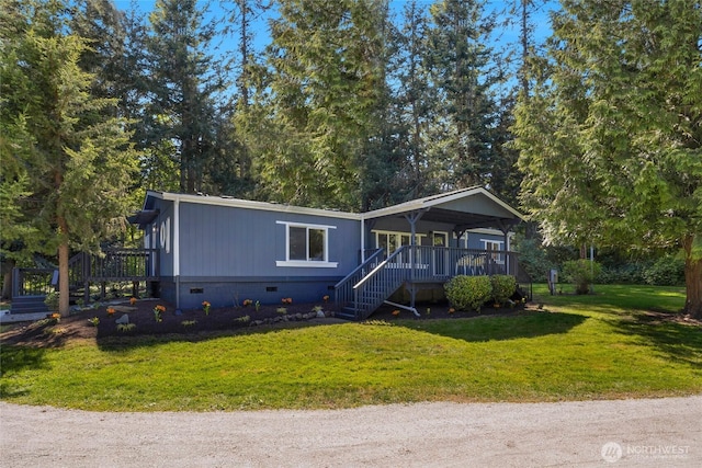view of front facade featuring a front yard, stairs, crawl space, and a deck