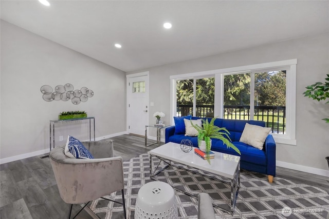 living room with recessed lighting, baseboards, and wood finished floors