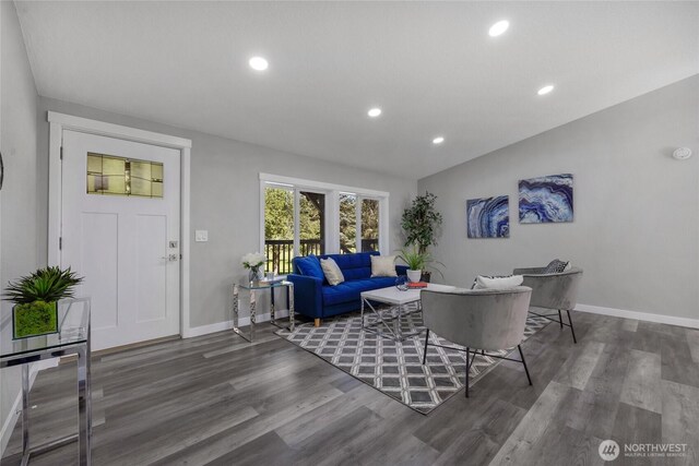 living area featuring baseboards, recessed lighting, and wood finished floors