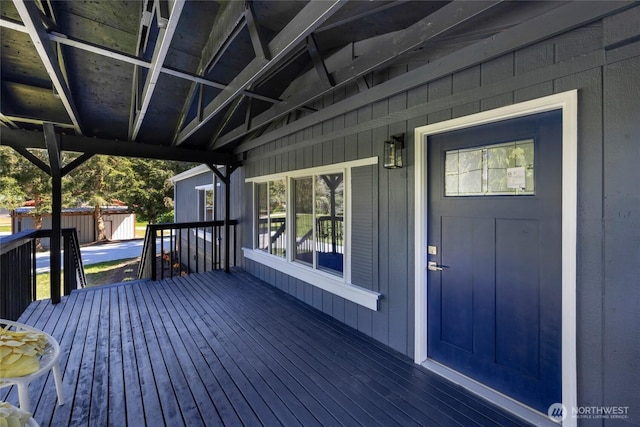 deck featuring an outdoor structure and a shed