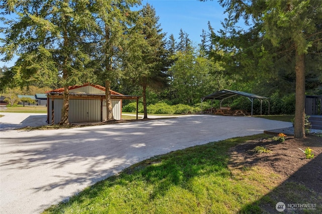 exterior space with a detached carport and an outdoor structure