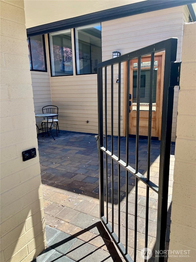 view of patio with a gate