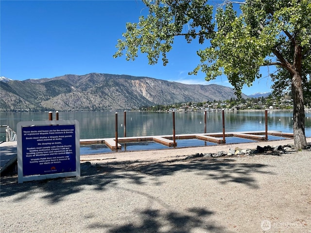 dock area featuring a water and mountain view
