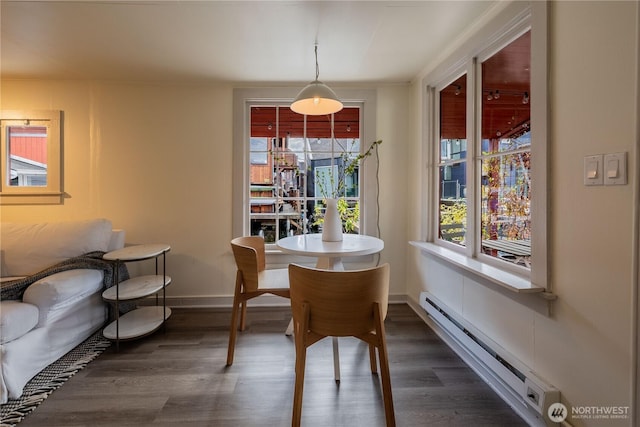 2035 Fairview Ave E Unit D, Seattle, WA 98102 - dining area featuring baseboards, a baseboard heating unit, and dark wood-style floors