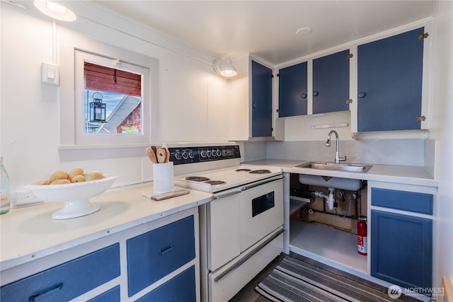 2035 Fairview Ave E Unit D, Seattle, WA 98102 - kitchen with a sink, light countertops, white electric range, and blue cabinets