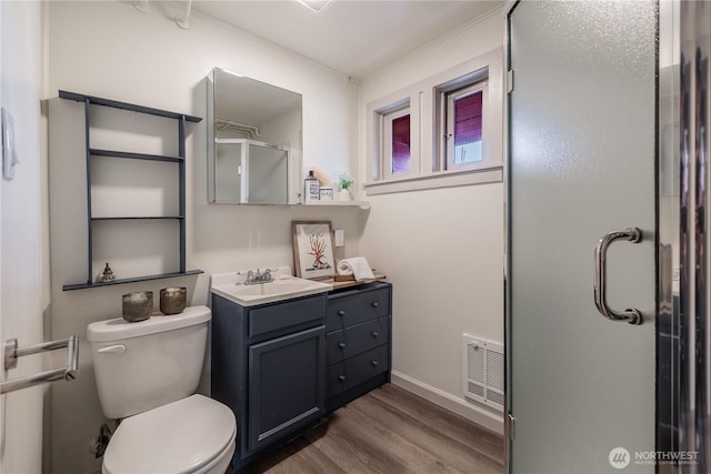 2035 Fairview Ave E Unit D, Seattle, WA 98102 - bathroom with visible vents, a stall shower, wood finished floors, vanity, and toilet