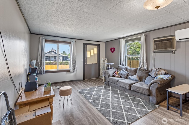 622 S Fair Ave, Yakima, WA 98901 - living area featuring crown molding, a wall unit AC, and wood finished floors