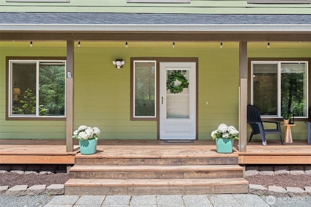 401 E Sunset Ridge Rd, Union, WA 98592 - entrance to property with a shingled roof and a wooden deck