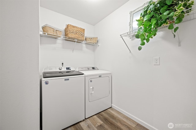 401 E Sunset Ridge Rd, Union, WA 98592 - laundry room featuring separate washer and dryer, wood finished floors, and baseboards