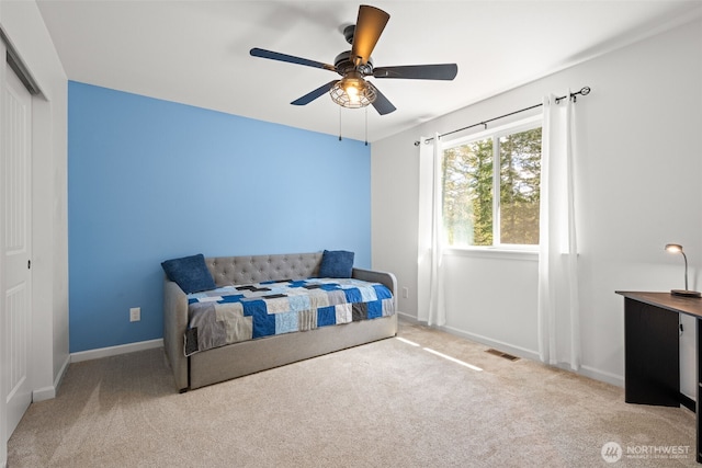 401 E Sunset Ridge Rd, Union, WA 98592 - carpeted bedroom with baseboards, a closet, and a ceiling fan