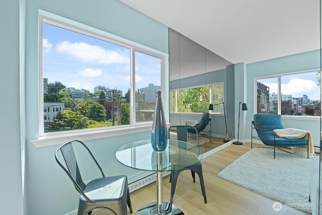 sunroom / solarium featuring a city view
