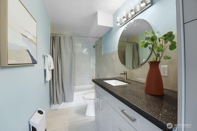 bathroom featuring vanity, shower / tub combo, tile patterned floors, and toilet