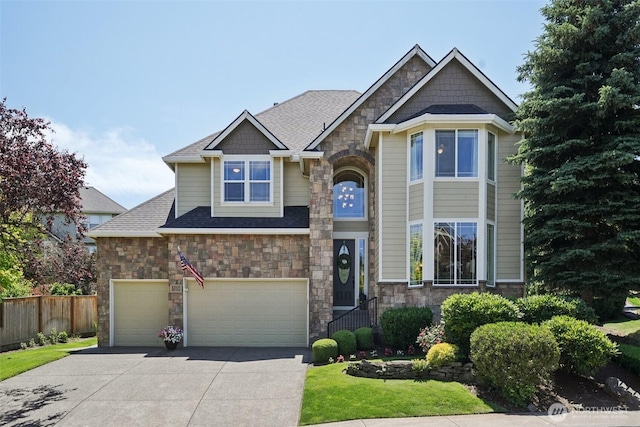 1610 NW 34th Ave, Camas, WA 98607 - craftsman inspired home featuring stone siding, driveway, an attached garage, and roof with shingles