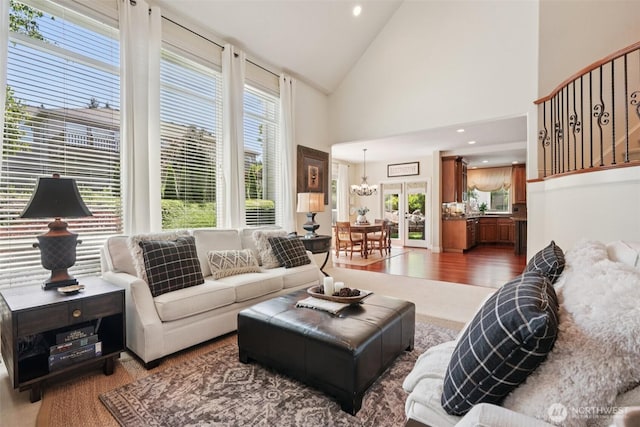 1610 NW 34th Ave, Camas, WA 98607 - living room featuring wood finished floors, high vaulted ceiling, and stairway