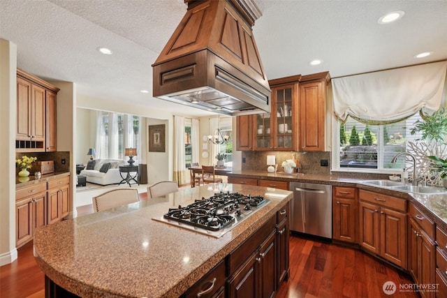 1610 NW 34th Ave, Camas, WA 98607 - kitchen featuring appliances with stainless steel finishes, dark wood finished floors, recessed lighting, a kitchen island, and backsplash