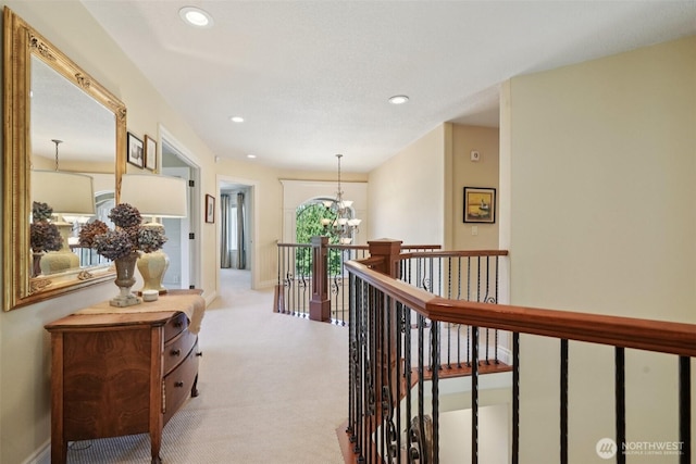 1610 NW 34th Ave, Camas, WA 98607 - hallway with carpet, an upstairs landing, recessed lighting, and a chandelier