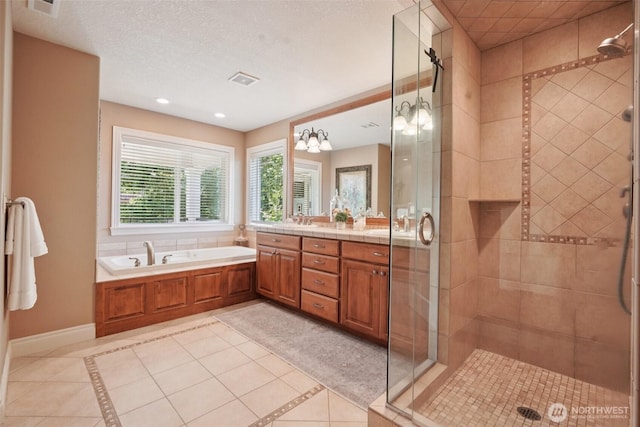 1610 NW 34th Ave, Camas, WA 98607 - full bath featuring double vanity, a stall shower, a bath, tile patterned flooring, and recessed lighting