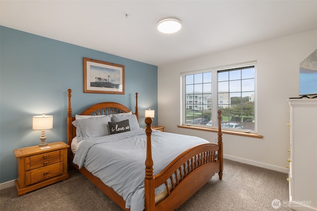 carpeted bedroom with baseboards
