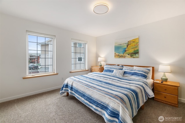 carpeted bedroom with baseboards