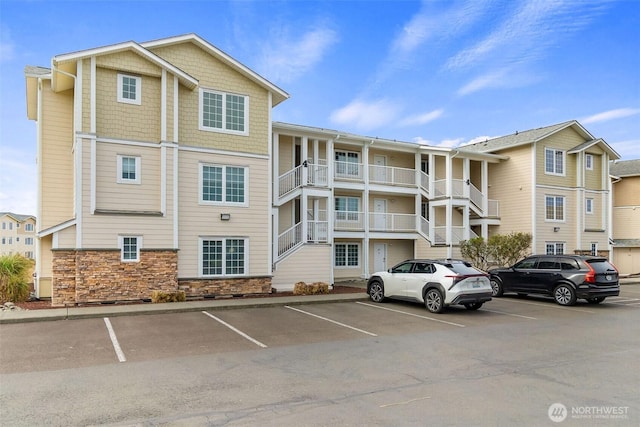 view of property with uncovered parking