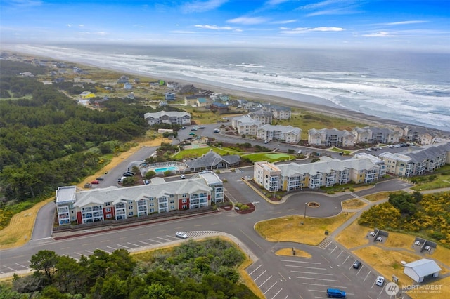 bird's eye view with a beach view and a water view