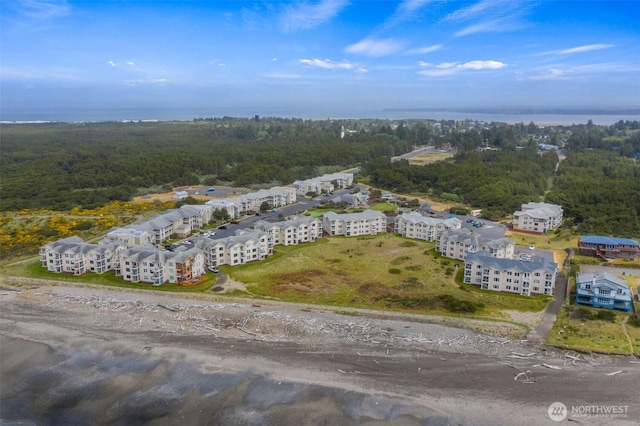 birds eye view of property with a forest view