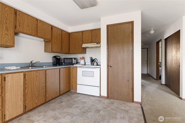 325 NE Kettle St Unit 102, Oak Harbor, WA 98277 - kitchen featuring brown cabinetry, white electric range, a sink, light countertops, and under cabinet range hood