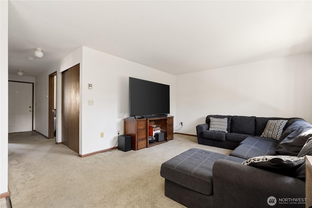 325 NE Kettle St Unit 102, Oak Harbor, WA 98277 - living room with baseboards and carpet