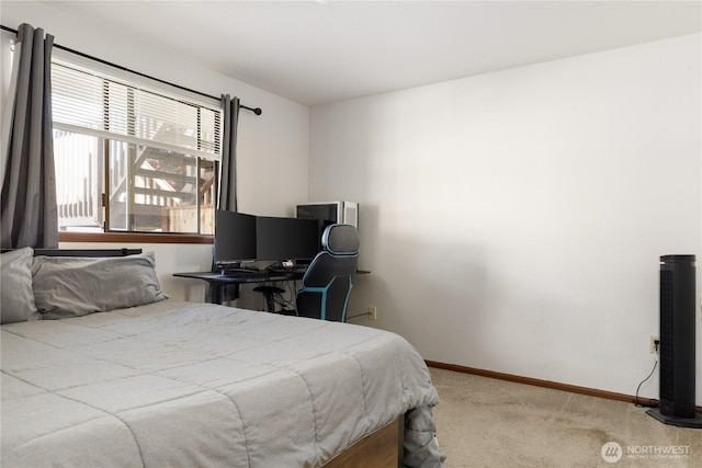 325 NE Kettle St Unit 102, Oak Harbor, WA 98277 - bedroom featuring baseboards and light carpet