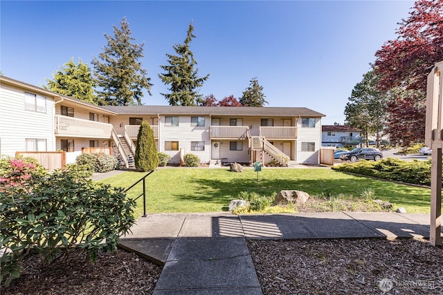 325 NE Kettle St Unit 102, Oak Harbor, WA 98277 - view of community with a yard and stairway