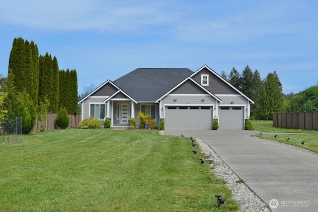 craftsman inspired home featuring a garage and driveway