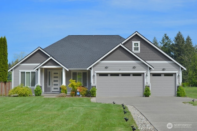 craftsman-style home with an attached garage and driveway