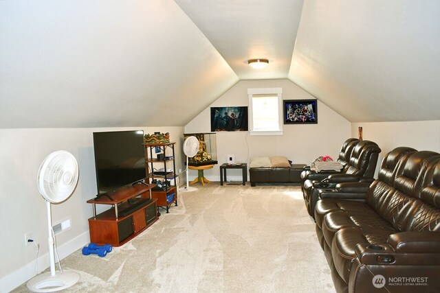 carpeted living room featuring vaulted ceiling and baseboards