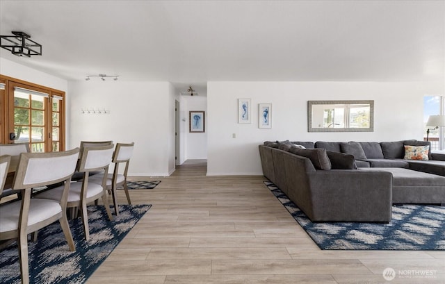 4966 Bradley Ln, Freeland, WA 98249 - living area featuring rail lighting and light wood-style flooring