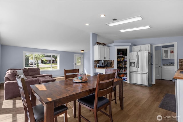 dining area with washer / dryer, wood finished floors, and recessed lighting
