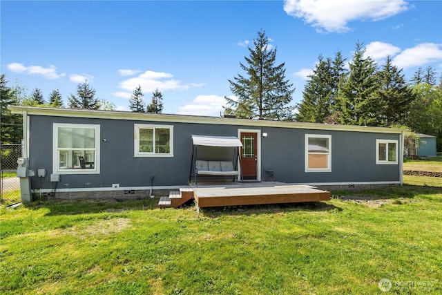 back of property with crawl space and a wooden deck