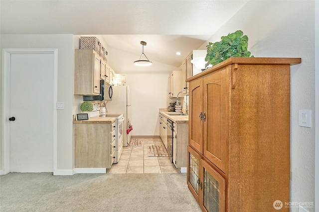 10822 SE 260th St Unit 2B1, Kent, WA 98030 - kitchen with light countertops, stainless steel appliances, baseboards, and light colored carpet