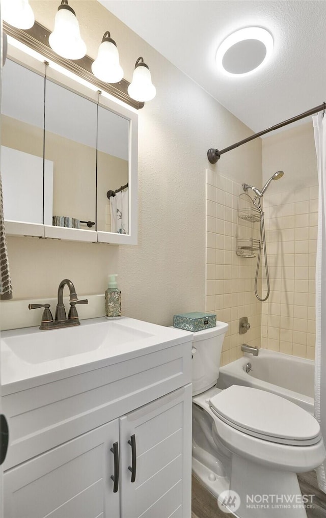 10822 SE 260th St Unit 2B1, Kent, WA 98030 - bathroom featuring vanity, shower / bath combo with shower curtain, and toilet