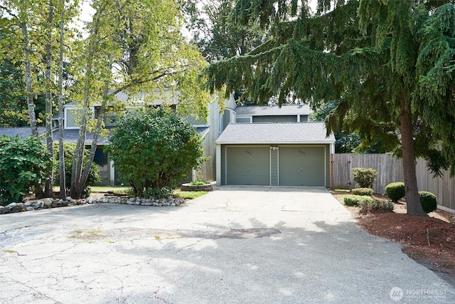 10822 SE 260th St Unit 2B1, Kent, WA 98030 - view of front of house with fence, a shingled roof, concrete driveway, and a garage