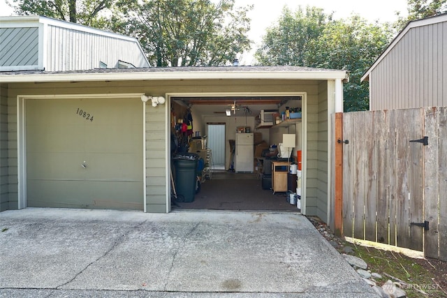 10822 SE 260th St Unit 2B1, Kent, WA 98030 - garage with fence and freestanding refrigerator