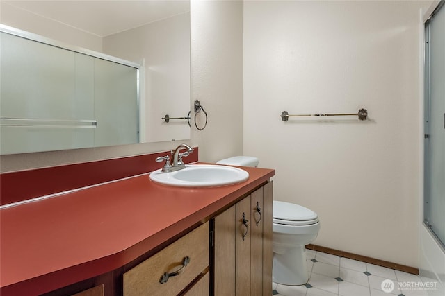 full bathroom with vanity, tile patterned flooring, a shower with door, toilet, and baseboards