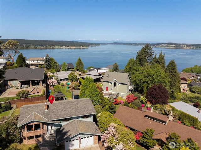 birds eye view of property featuring a water view and a residential view