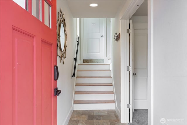 stairway featuring baseboards and recessed lighting