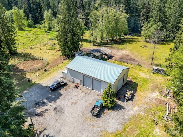 view of subject property with a heavily wooded area